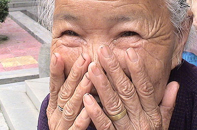 Inspire old woman laughing